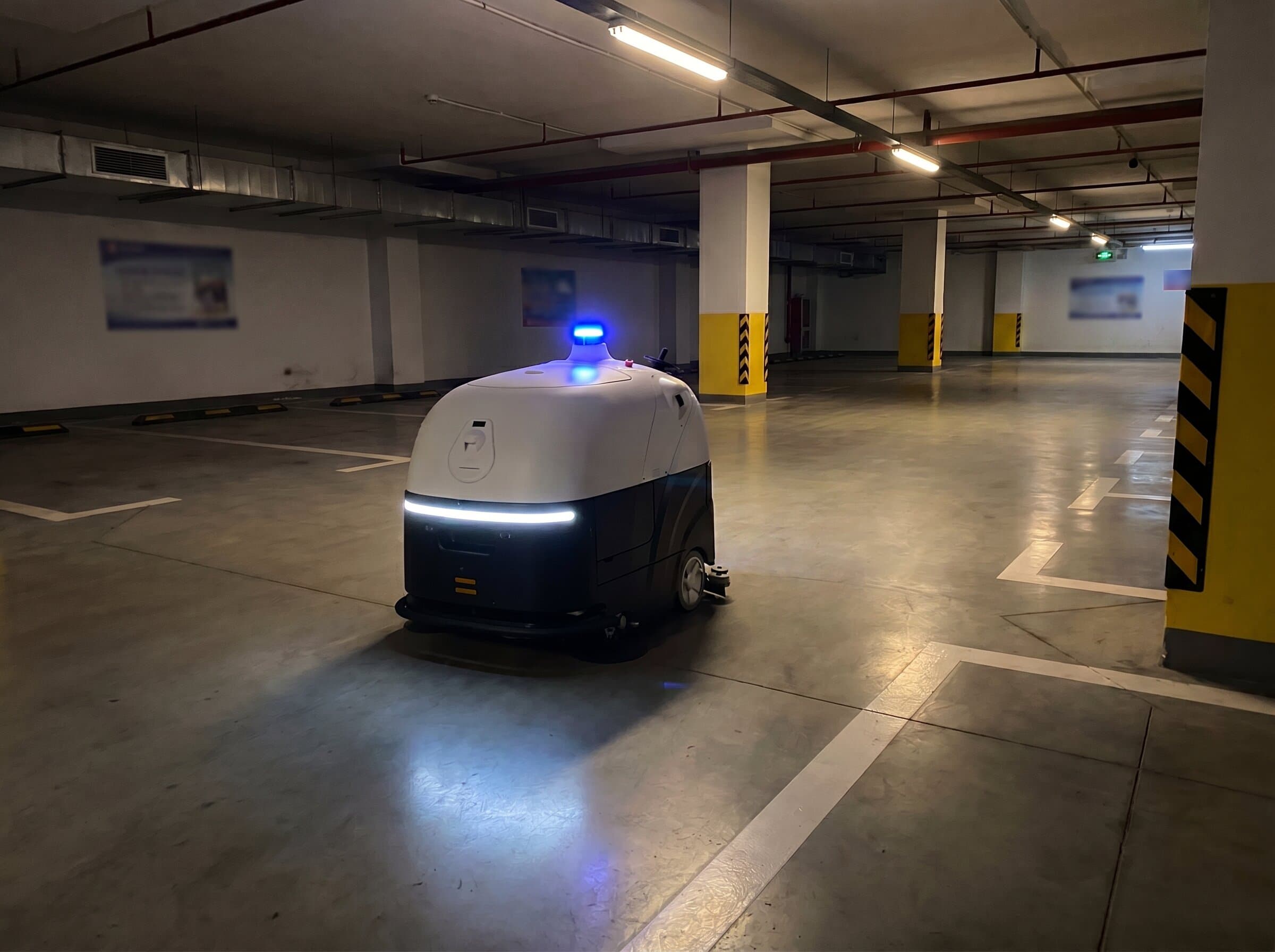 VIGGO SC80 Pro robot in an underground garage with its contour and strobe lights lit